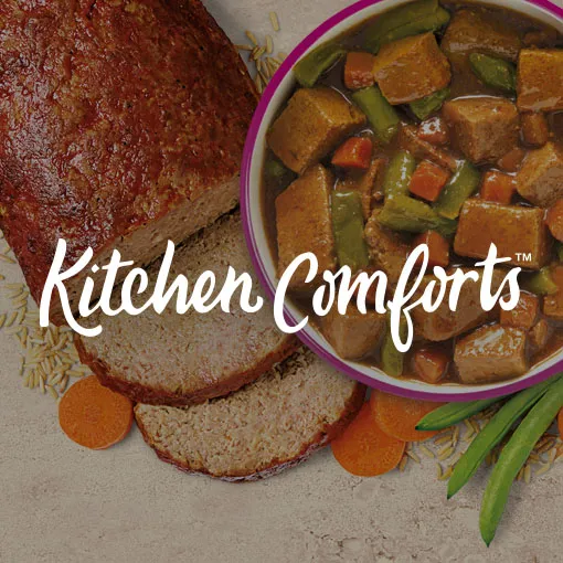 1. A meatloaf sliced with oieces of rice and sliced carrots along side a bowl of Kitchen Comforts wet. 